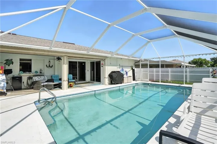 Ranch-style home with stucco siding, concrete driveway, and an attached garage