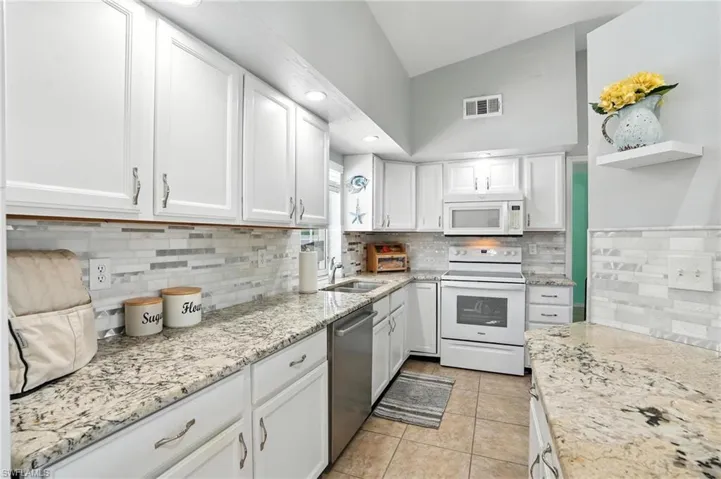 Bedroom with access to exterior, ceiling fan, and tile patterned flooring