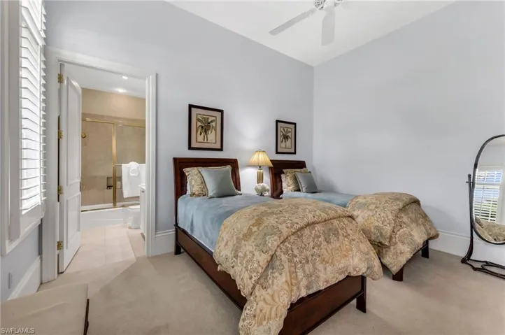 Spacious, ensuite guest room with large, walk-in closet.