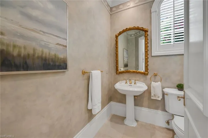 This powder room next to the office can be remodeled into a fourth, full bath, as this has been done in similar residences in this neighborhood.