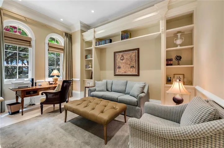 The office has custom built-ins and could easily be converted into a fourth bedroom, with the powder room next to it.
