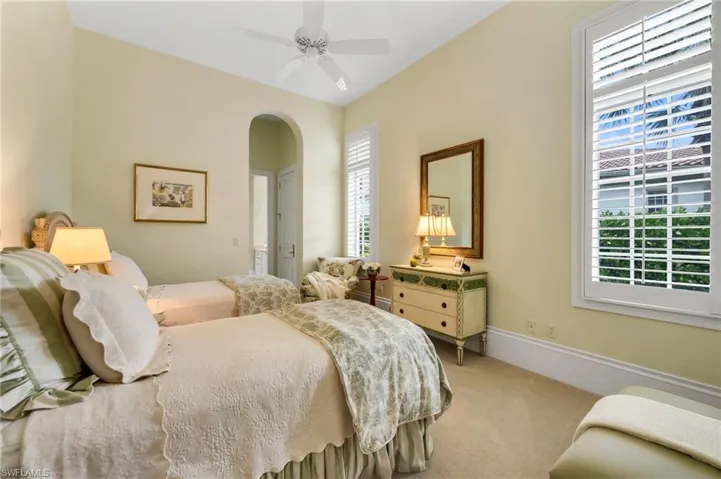 Spacious, ensuite guest room with large, walk-in closet.