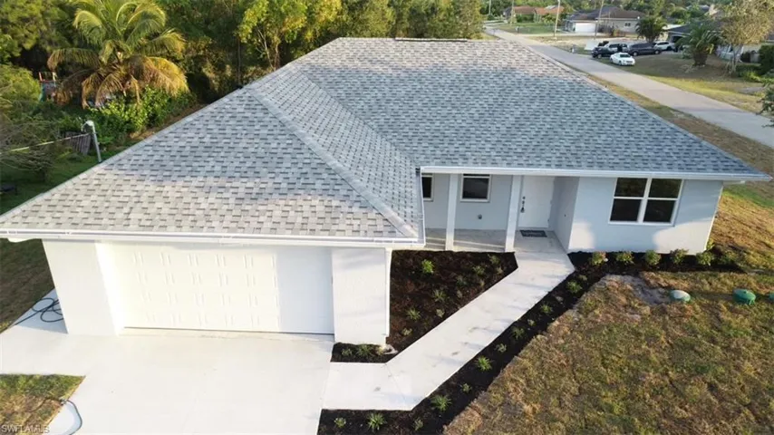 702  Manhattan E ST, Lehigh Acres, FL 33974
