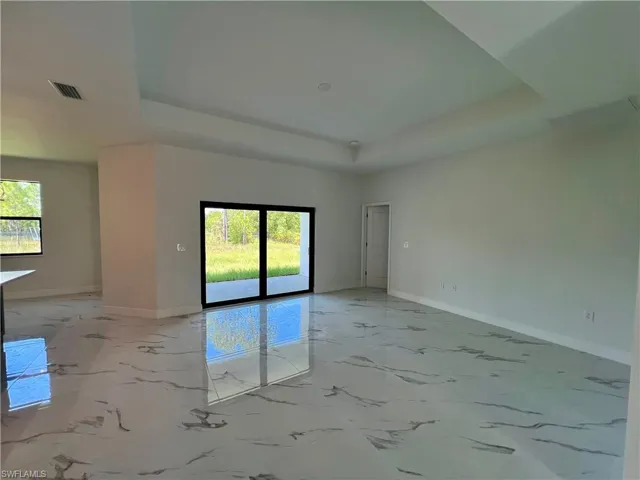 Living room with a tray ceiling.