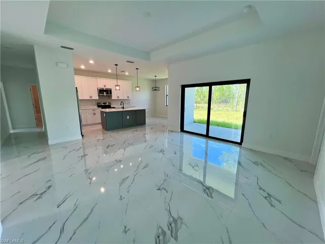 Living room with a tray ceiling.