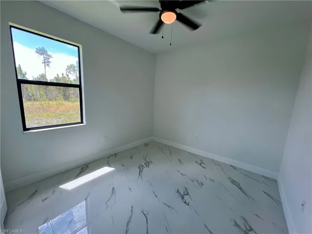 Guest bedroom featuring ceiling fan