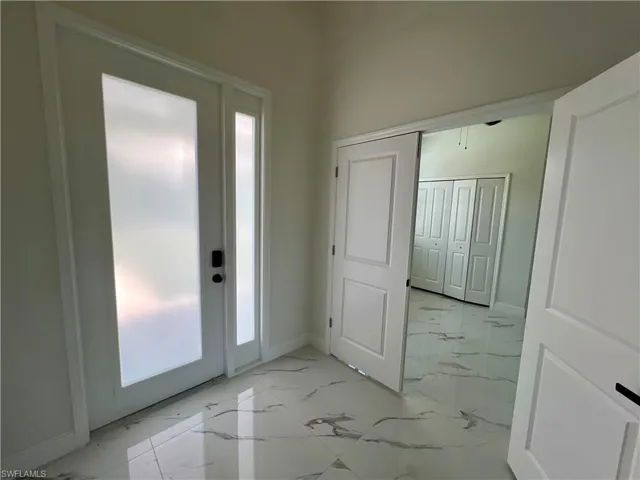 View of entrance foyer to den