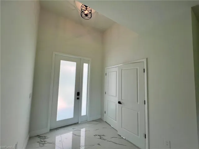 View of entry foyer to den