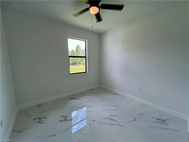 Guest bedroom featuring ceiling fan