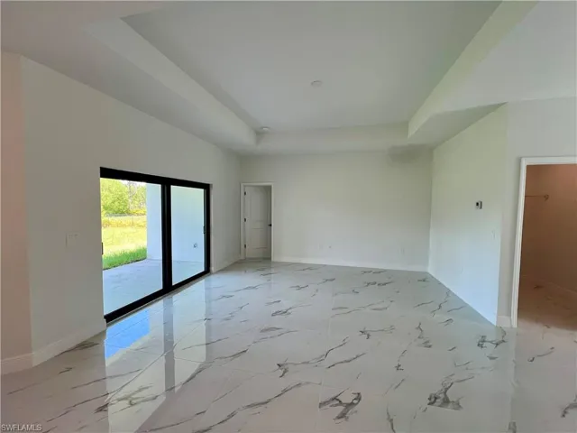 Living room with a tray ceiling.
