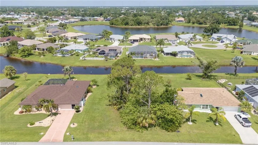 BUILD Y0UR DREAM HOME ON THIS BEAUTIFUL LOT IN THE COMMUNITY OF DEEP CREEK IN PUNTA GORDA.