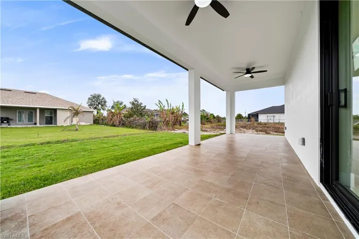 View of patio featuring a ceiling fan