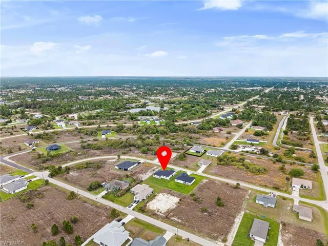 Aerial overview of property's location with nearby suburban area