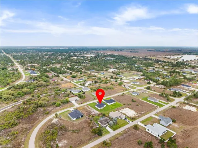 View of property location with nearby suburban area