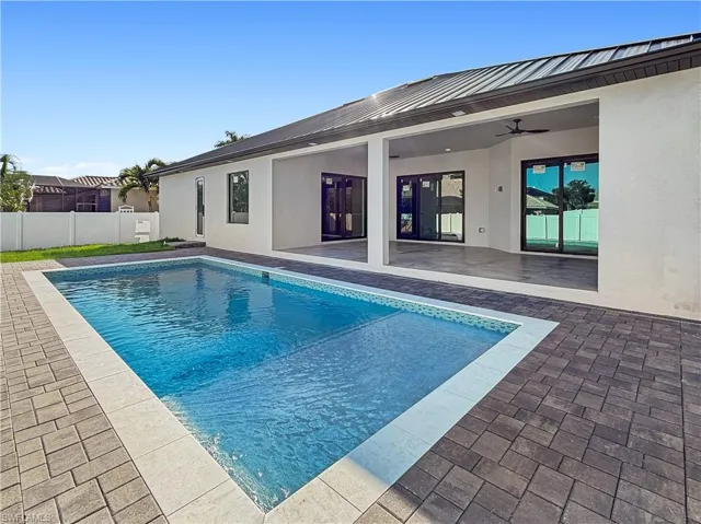View of pool featuring a ceiling fan and a patio area