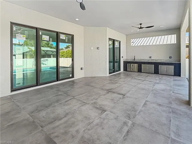 View of patio / terrace featuring ceiling fan and exterior kitchen