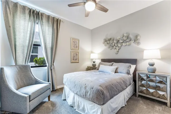 Bedroom featuring carpet and ceiling fan