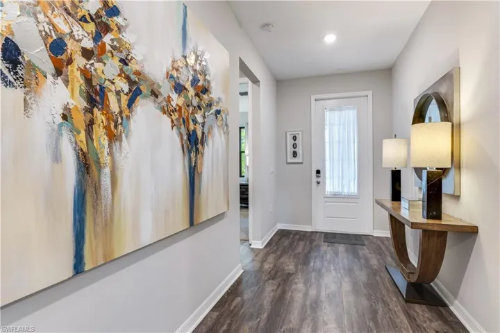 Foyer with dark hardwood / wood-style floors
