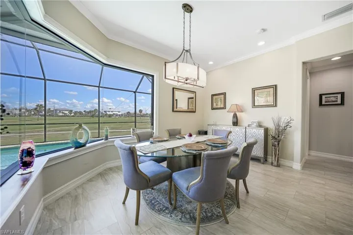 Dining area with ornamental molding