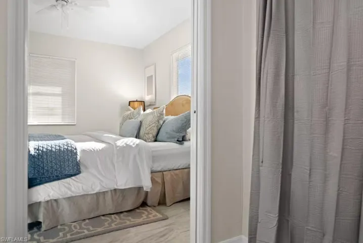 Bedroom with ceiling fan and baseboards