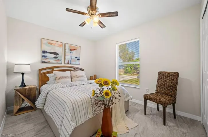 Bedroom featuring a ceiling fan and a closet