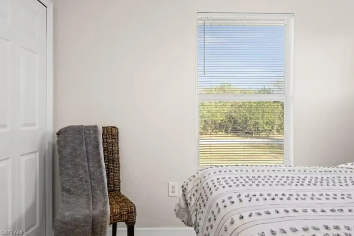 Bedroom featuring baseboards