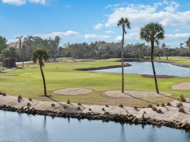 View of community featuring a water view, a yard, and view of golf course