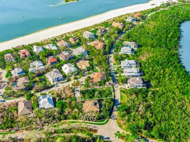 Aerial perspective of suburban area with unending shoreline
