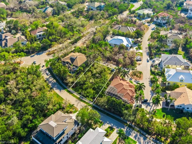 Aerial perspective of suburban area featuring property parcel outlined
