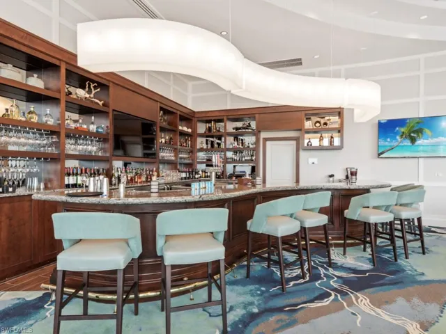 Community bar area featuring hanging light fixtures