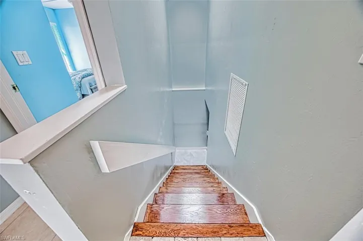 Interior stairs to lower level and 2-car garage