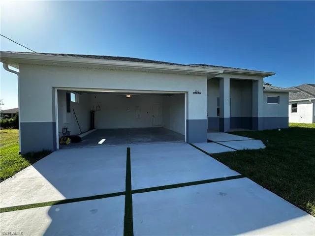 View of front of property with a garage