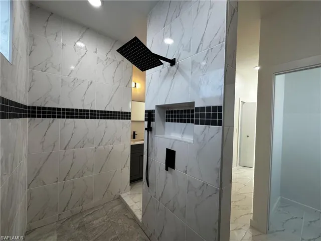 Bathroom with vanity and walk in shower