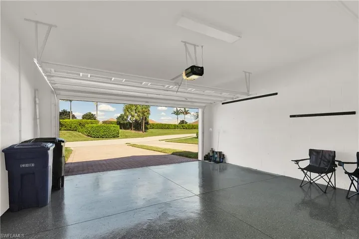 Garage featuring a garage door opener