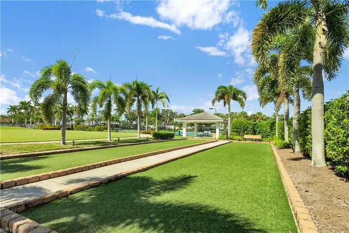Surrounding community featuring a gazebo, a bocce ball area, and a yard