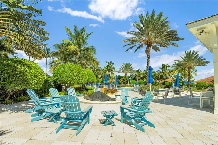 View of patio / terrace with an outdoor fire pit and a community pool