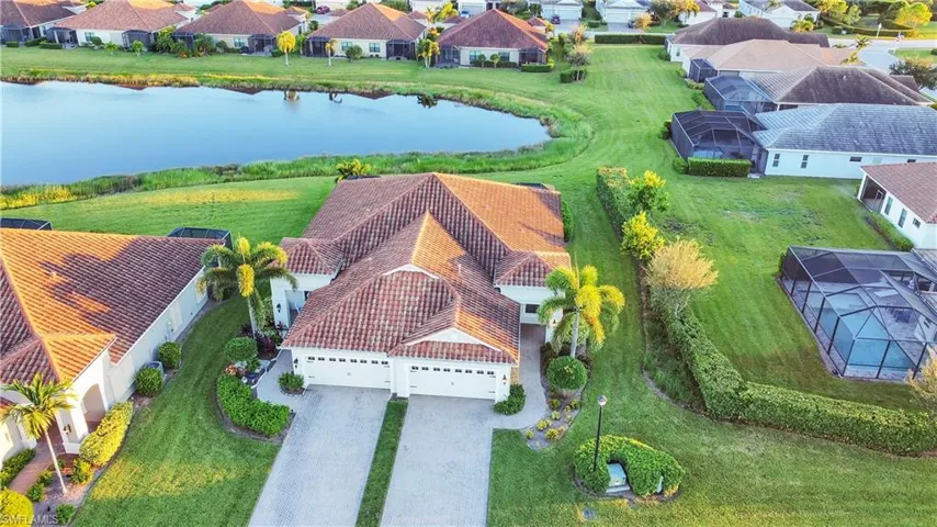 Aerial perspective of suburban area with a nearby body of water
