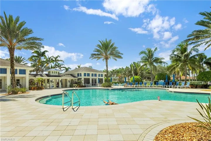 Community pool with a patio area