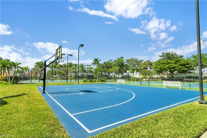 View of basketball court featuring community basketball court and a tennis court