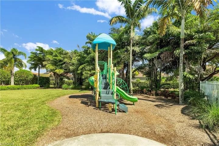 Community playground featuring a yard