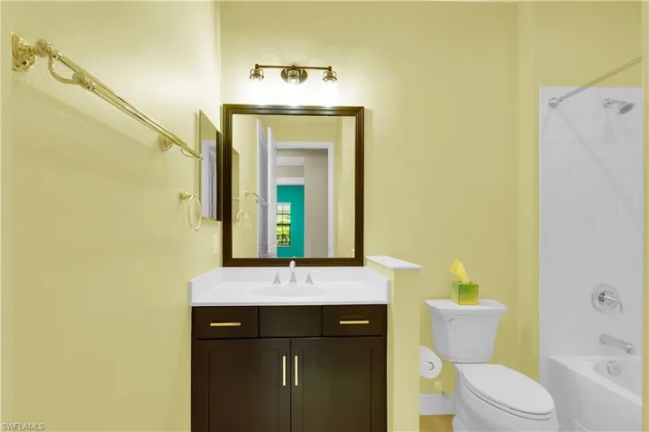 Full bath featuring tub / shower combination and vanity