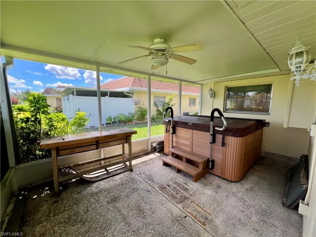 Sunroom / solarium featuring ceiling fan