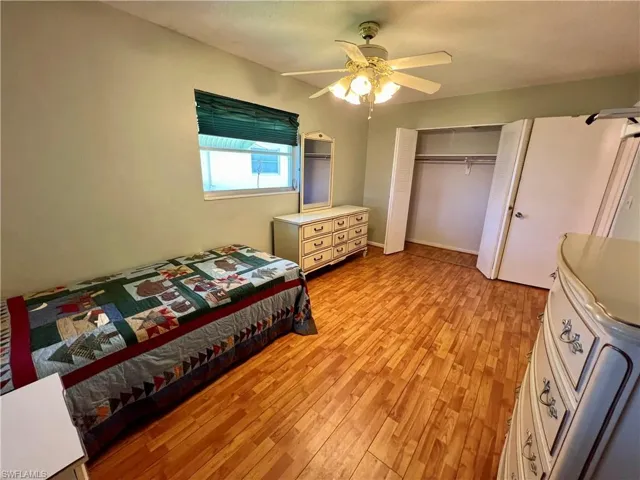 Bedroom featuring a closet, ceiling fan, and light wood-type flooring