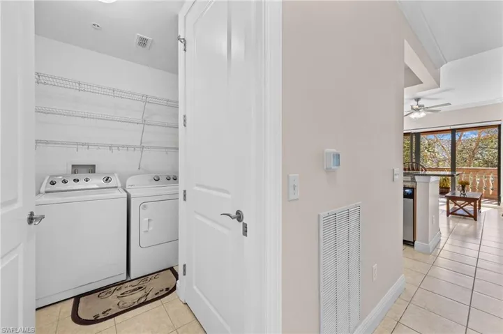 Laundry room with closet & shelves