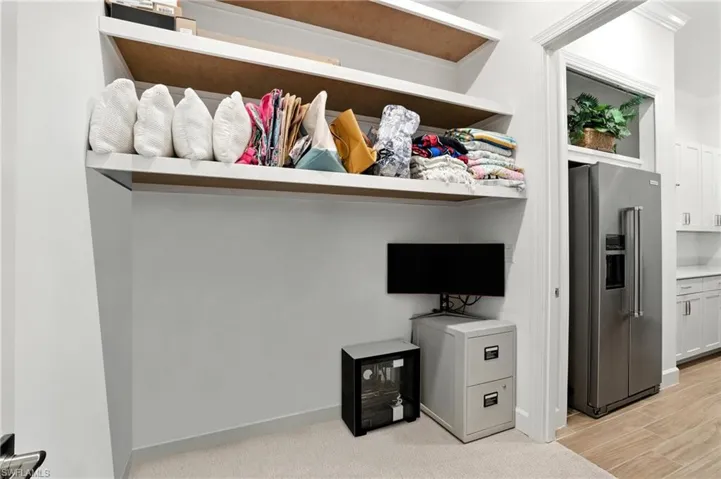 Addt owners closet connecting owners bath and laundry