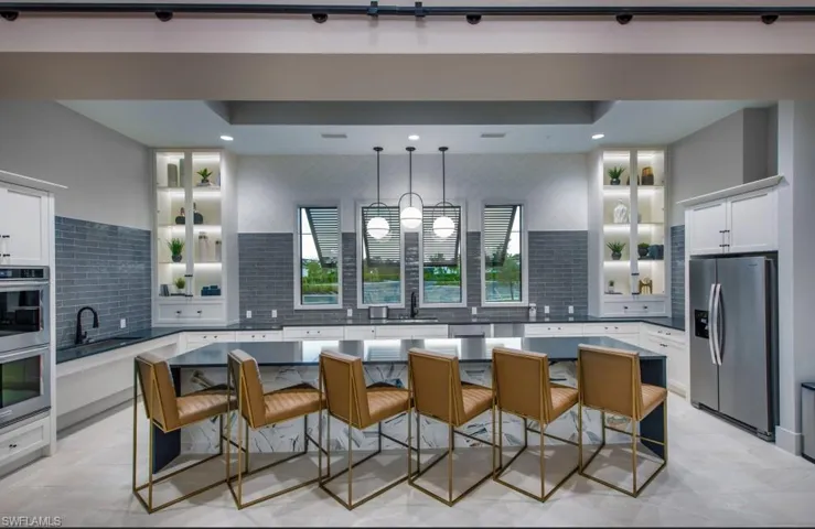 Kitchen featuring glass insert cabinets, white cabinets, backsplash, appliances with stainless steel finishes, and recessed lighting