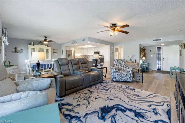 Open-concept living area featuring light wood-finish flooring throughout
