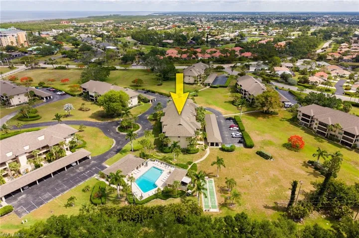 Multi-unit property situated within a complex featuring mature landscaping