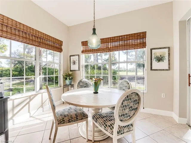Dining area with plenty of natural light and light tile patterned floors