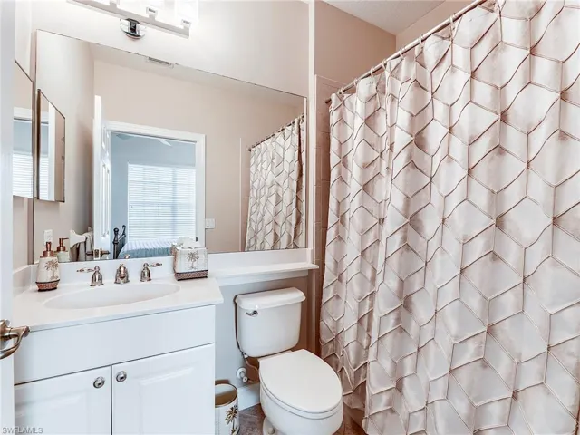 Full bathroom with a shower, vanity, and connected bathroom